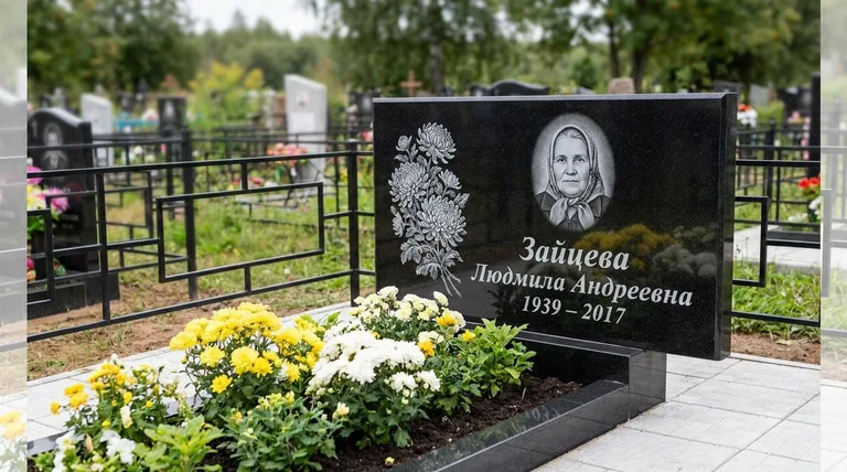 Памятник с гравировкой хризантем — выполненная работа «Зайцева» в Санкт-Петербурге